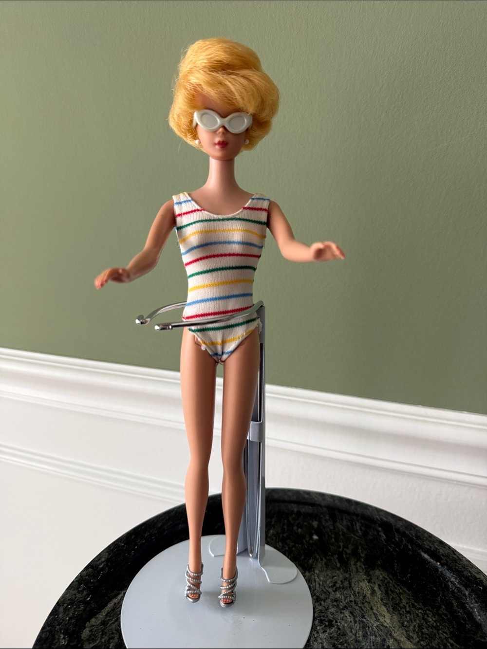 1963β1965 Bubblecut Barbie Doll with mixed vintage outfits